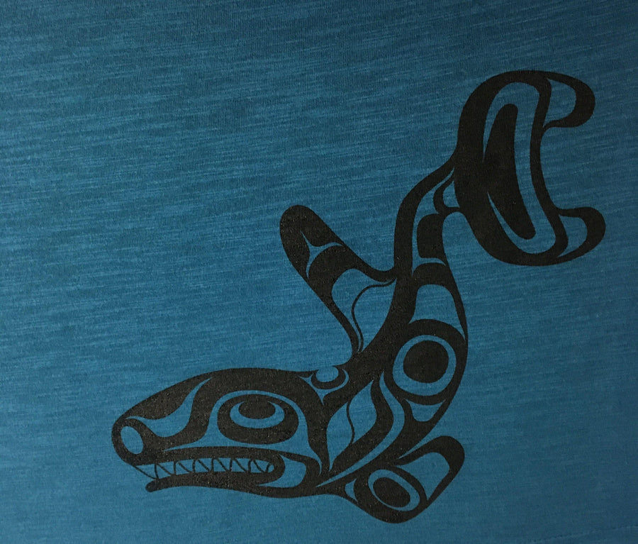 Close up view of womens organic cotton top by indigenous artist featuring the killer whale