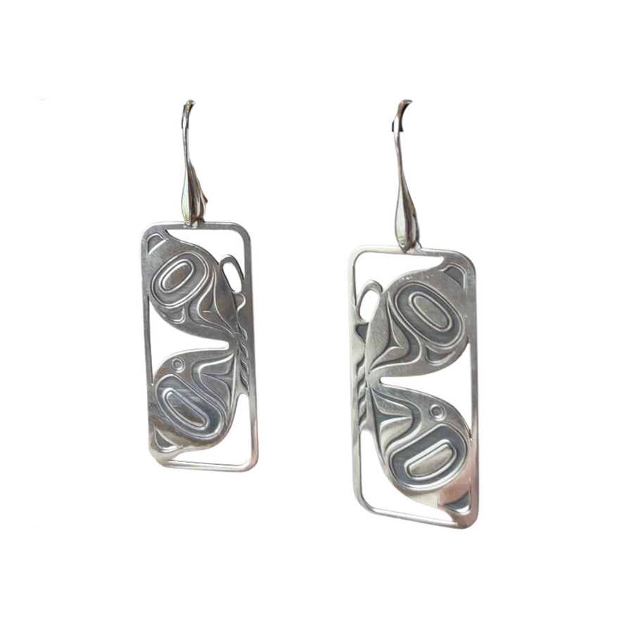 Close up of butterfly earrings by indigenous artist silver