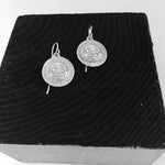 Close up of earrings silver moon or sun by indigenous artist 5