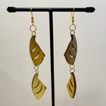 Close up up of puffin beak earrings by indigenous artist acrylic