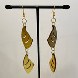 Close up up of puffin beak earrings by indigenous artist acrylic
