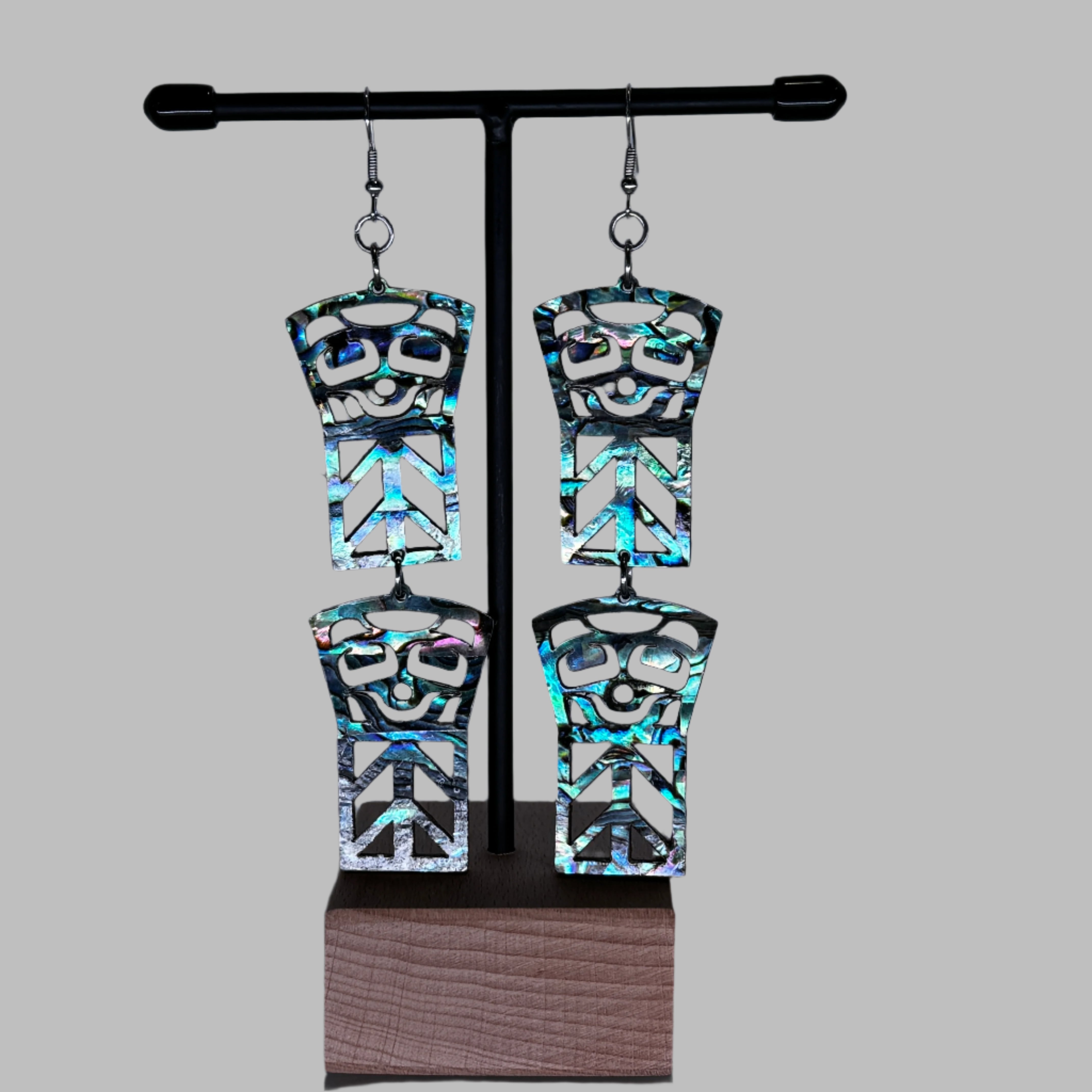 tiered earrings made of vivid abalone shell that measure 1" wide and 4" long with 2 copper design