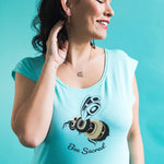 Model wearing Women's Bee Sacred cap sleeve top by indigenous artist Andy Everson