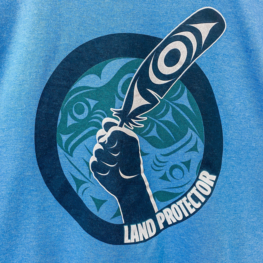 Close up of Land Protector Unisex T shirt by indigenous artist Andy Everson