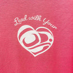 Close up of Lead With Your Heart Unisex T shirt  by indigenous artist in dark pink