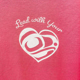 Close up of Lead With Your Heart Unisex T shirt  by indigenous artist in dark pink