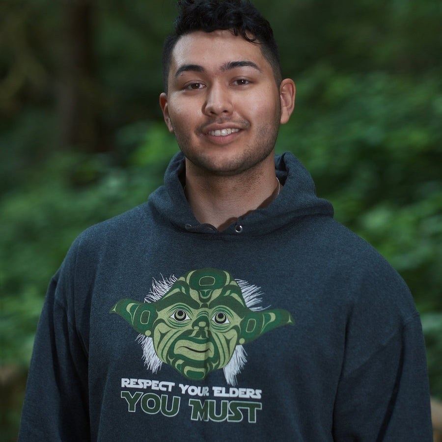 Model wearing unisex hoodie called elder by indigenous artist