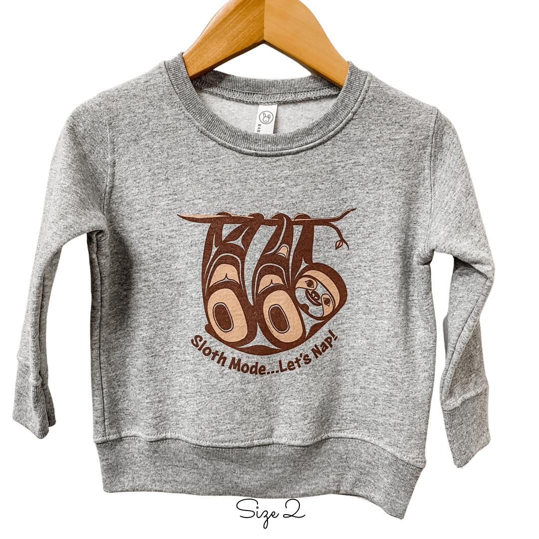 Front view of Native apparel kids sweatshirt featuring the sloth by Indigenous artist 4