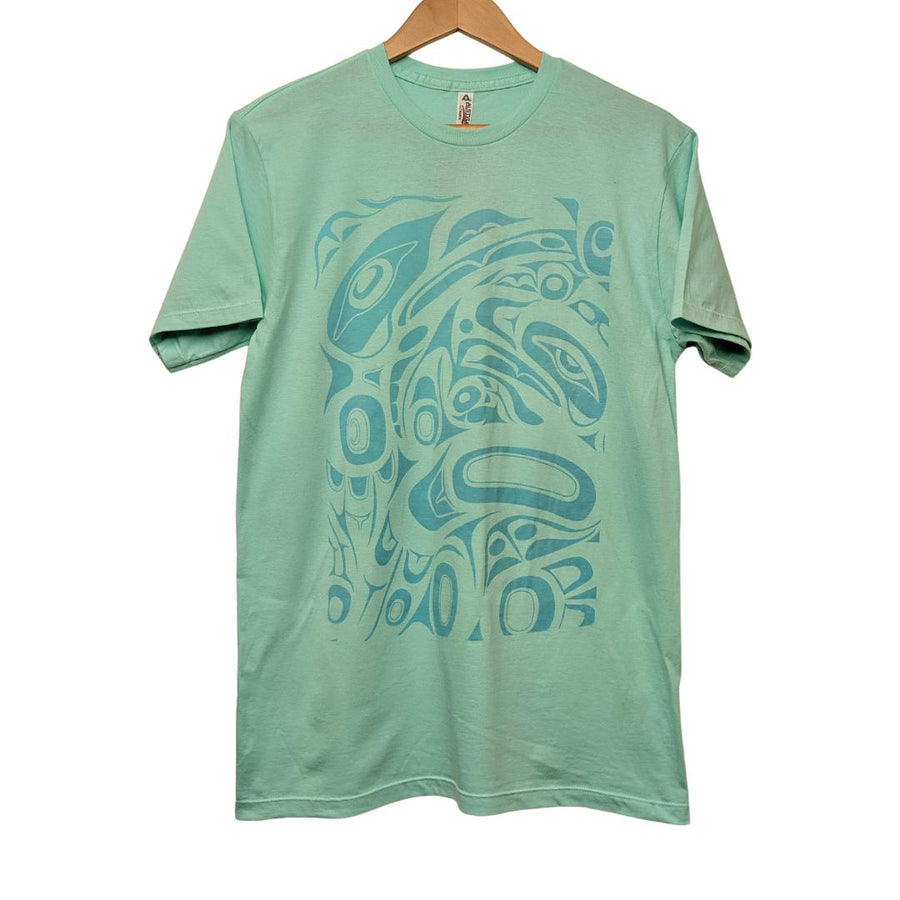 Front view of unisex t-shirt raven and eagle motif by indigenous artist in light green