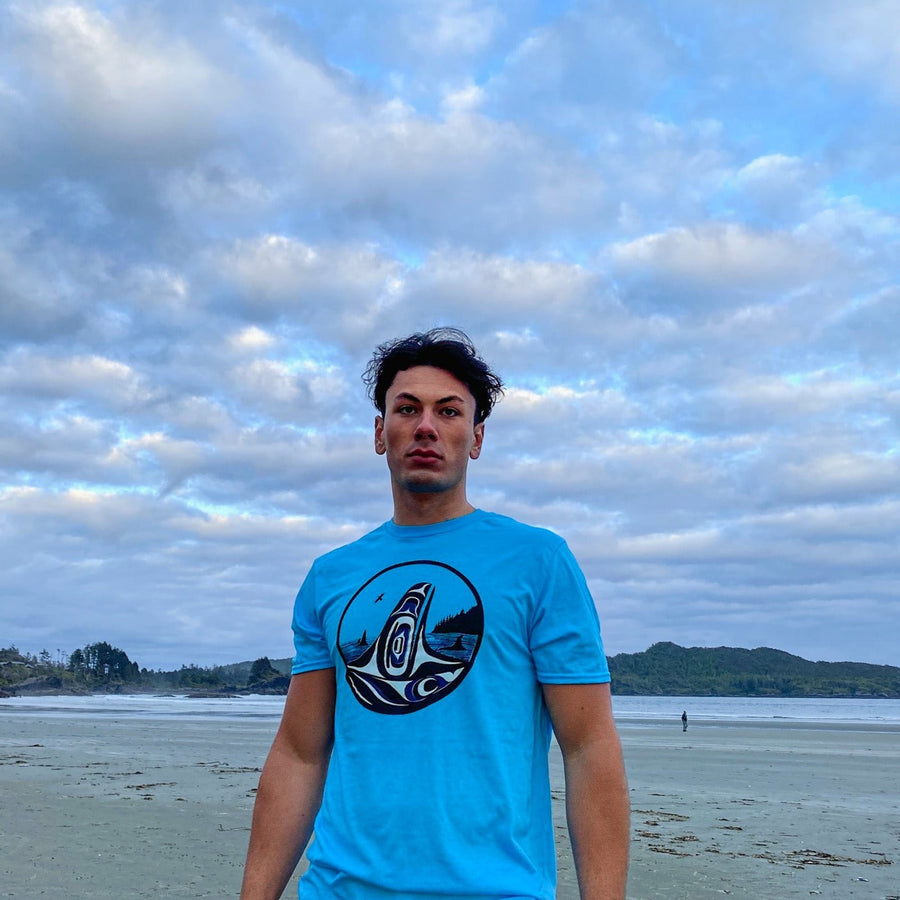 Model wearing unisex t-shirt featuring Raven-Fin Killer Whale by indigenous artist