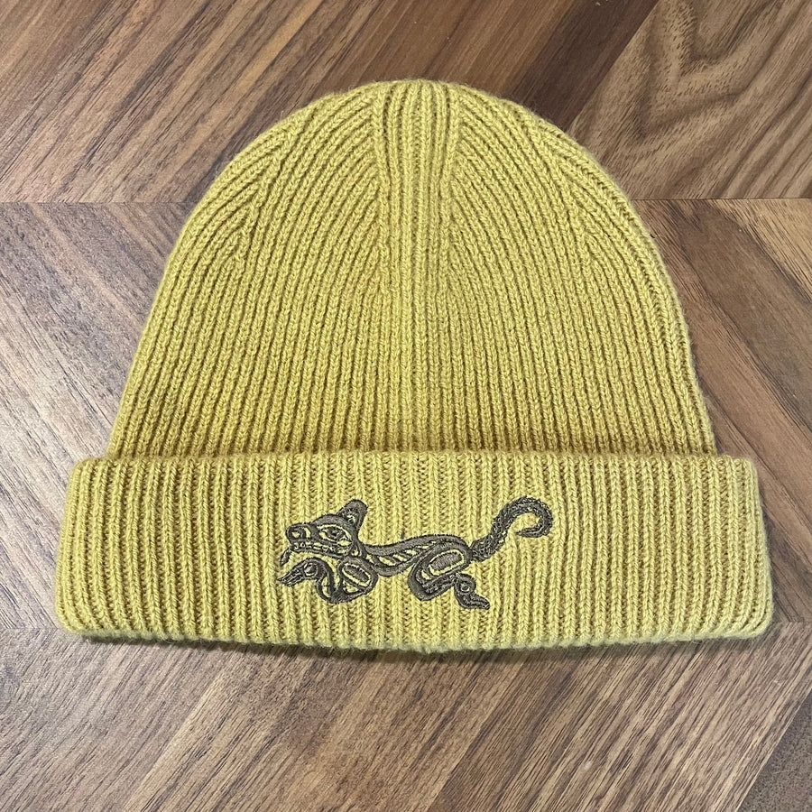 warm yellow wool winter hat with embroidered Wolf design by Haida artist Jesse Brillon