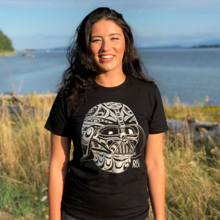 Model wearing Unisex T-shirt called Rise by indigenous artist Andy Everson