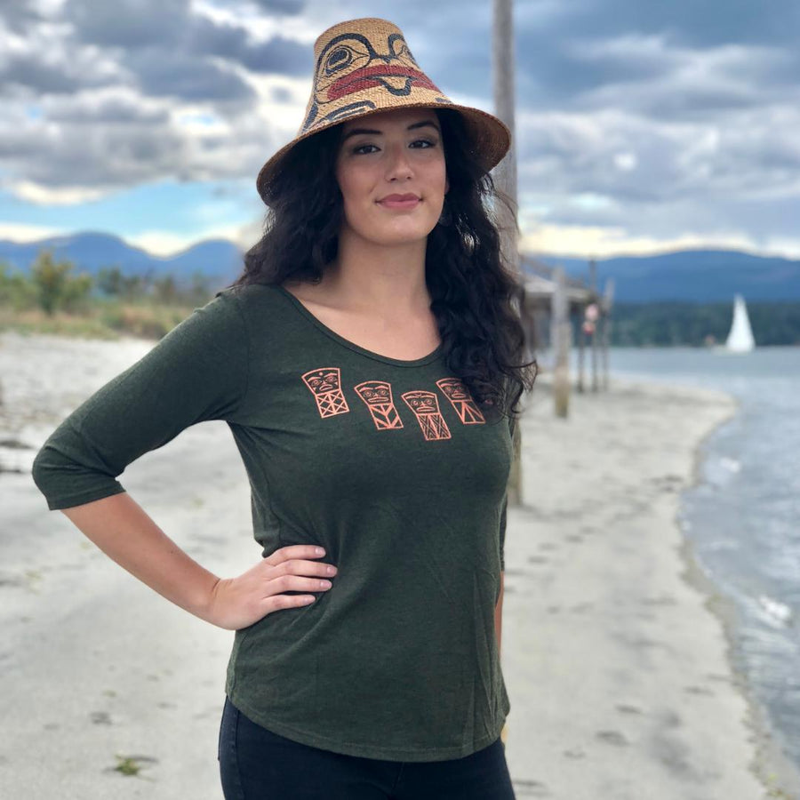 Model standing outside wearing womens organic cotton top by indigenous artist called coppers
