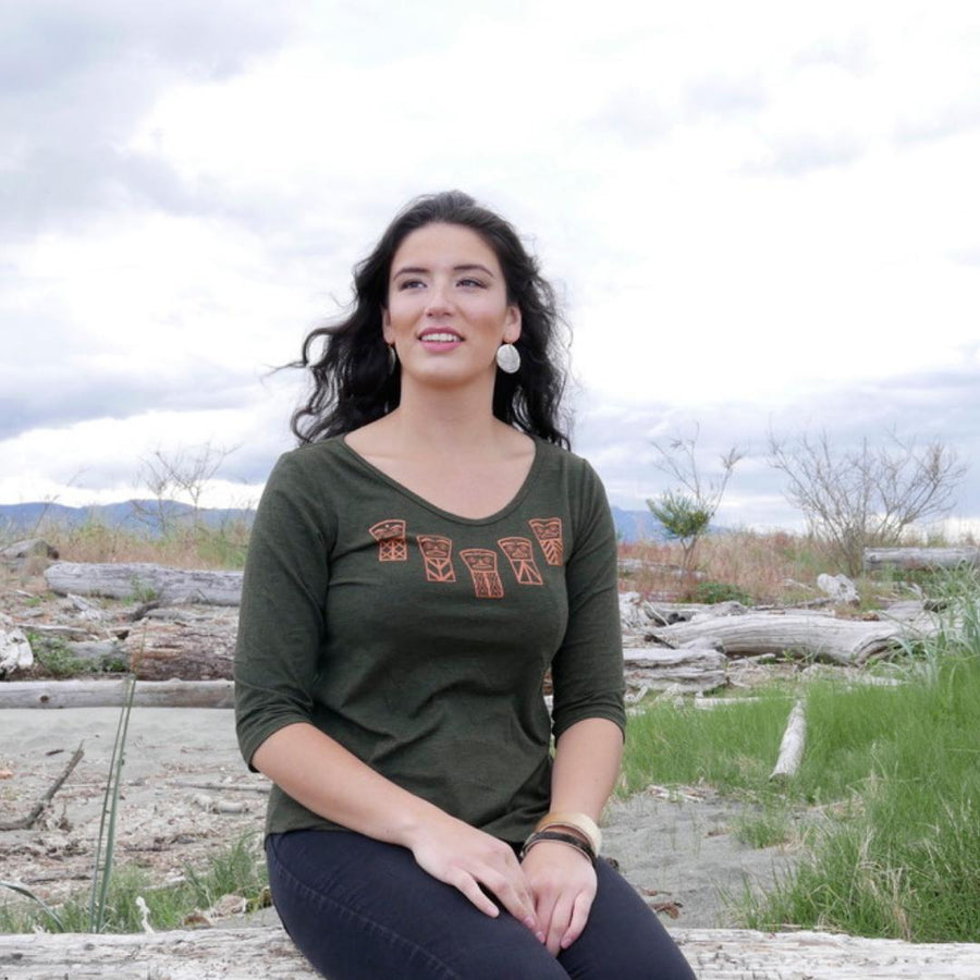 Model outside wearing womens organic cotton top by indigenous artist called coppers