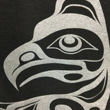 Model outside wearing womens organic cotton top by indigenous artist featuring eagle closeup