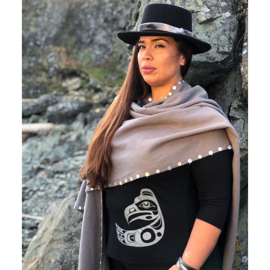 Model outside wearing womens organic cotton top by indigenous artist featuring eagle in black with shall