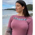 Model wearing womens top created by indigenous artist called moon phase