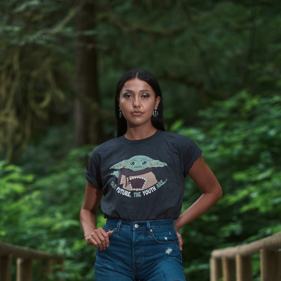 Model wearing Unisex T-shirt called Youth by indigenous artist Andy Everson
