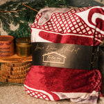 Cozy Night In: Premium Fleece Blanket by Andy Everson, MediciTeas tin and Illuminated Intentions candle