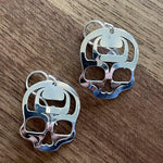 Close up of ancestral skull earrings by indigenous artist sterling silver