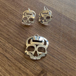 Close up of ancestral skull earrings by indigenous artist sterling silver 2