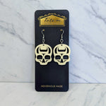 Close up up of ancestral skull earrings by indigenous artist acrylic