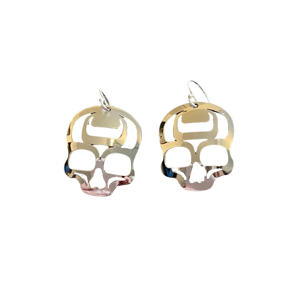 Close up up view of ancestral skull earrings by indigenous artist sterling silver