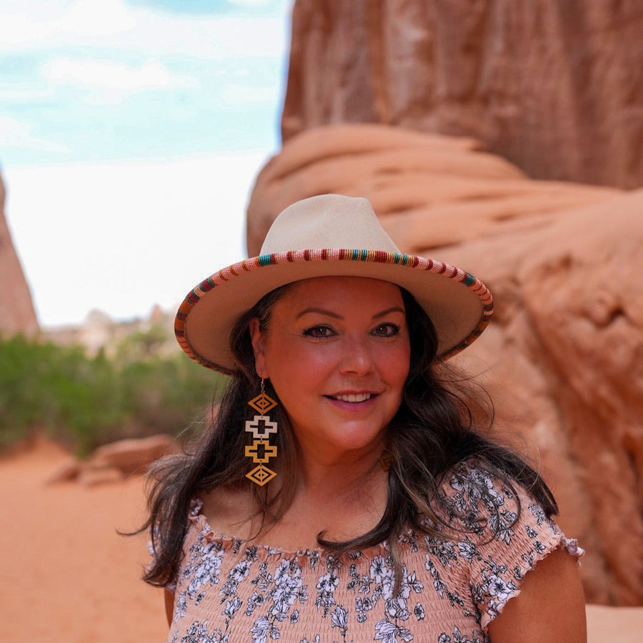 Model wearing blingit customizable earrings by indigenous artist acrylic