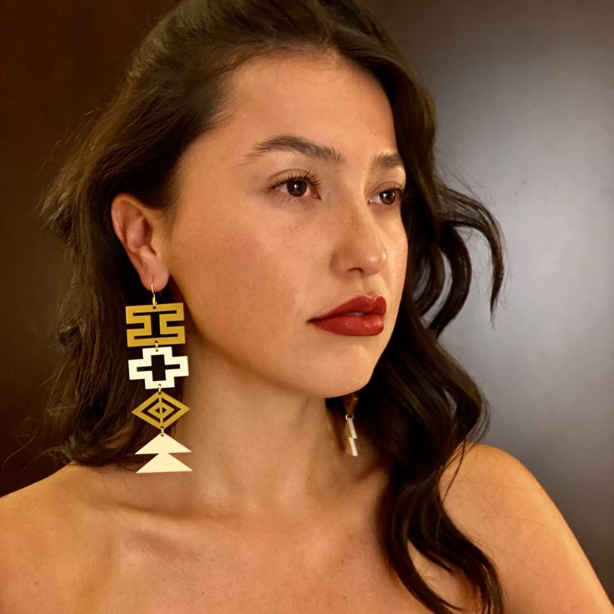 Model wearing blingit customizable earrings by indigenous artist acrylic 2