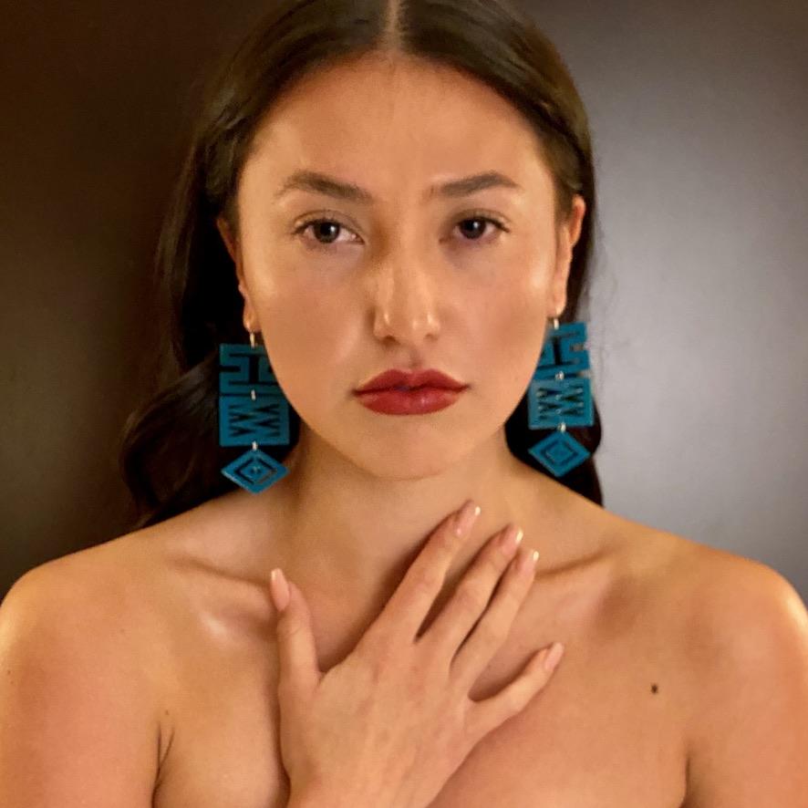 Model wearing blingit customizable earrings by indigenous artist acrylic 4