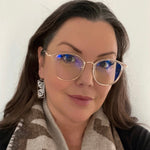 Model wearing butterfly earrings by indigenous artist silver