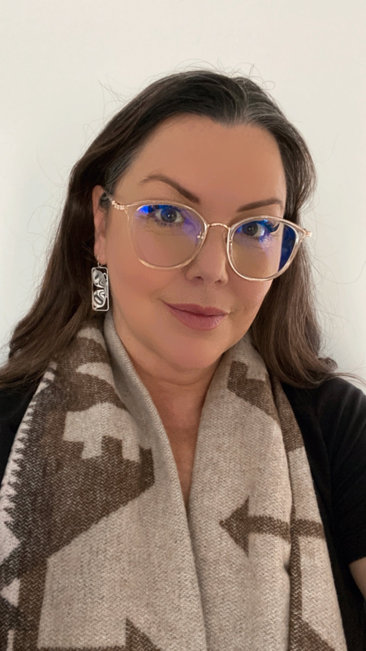 Model wearing butterfly earrings by indigenous artist silver 2