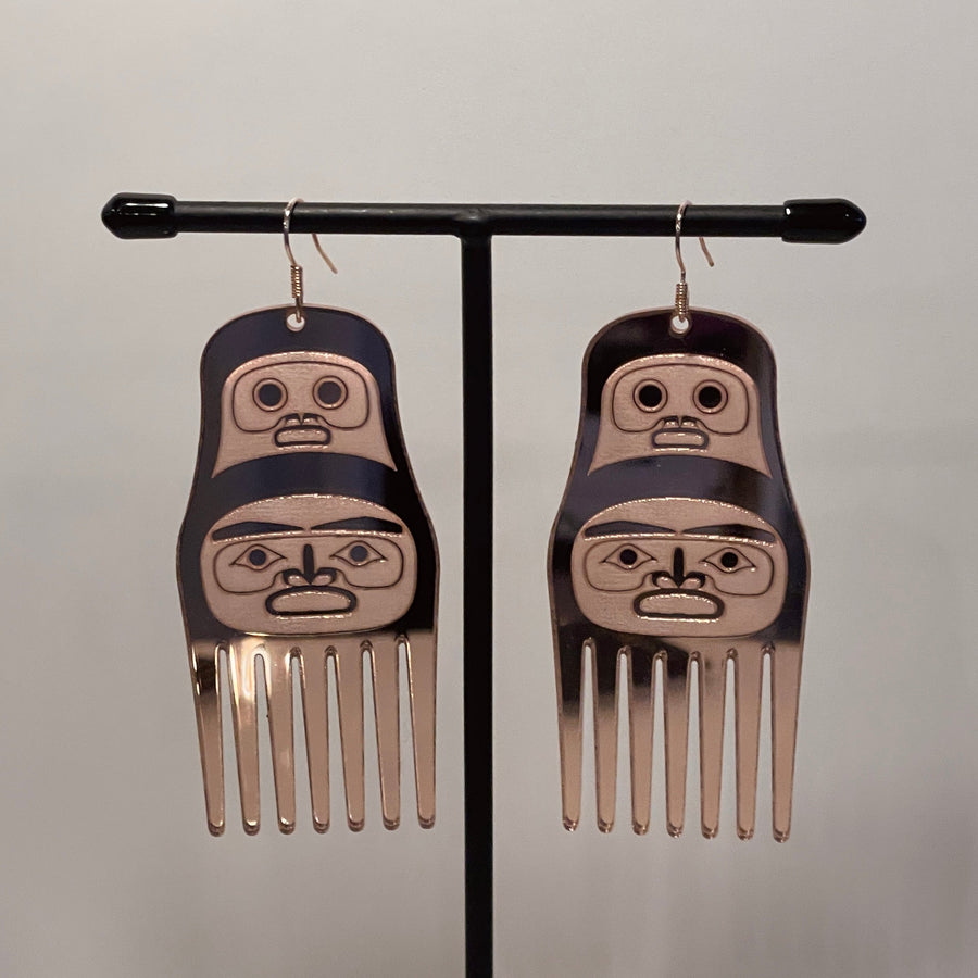 Close up up of comb earrings by indigenous artist acrylic