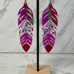 Close up up of dynamic tiered feather earrings by indigenous artist acrylic 2