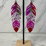 Close up up of dynamic tiered feather earrings by indigenous artist acrylic 2