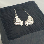 Close up of earrings silver feather by indigenous artist in box