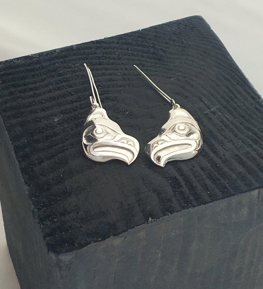 Close up of earrings silver feather by indigenous artist in box