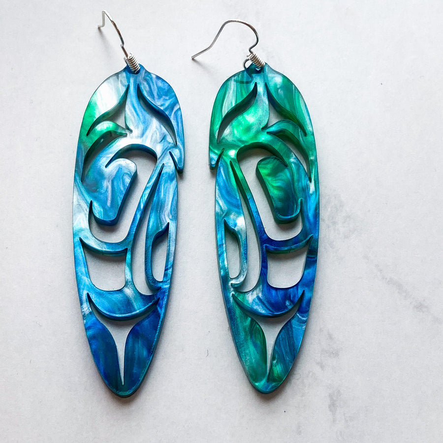 Close up of feather earrings by indigenous artist acrylic 5