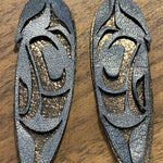 Close up of feather earrings by indigenous artist leather 2