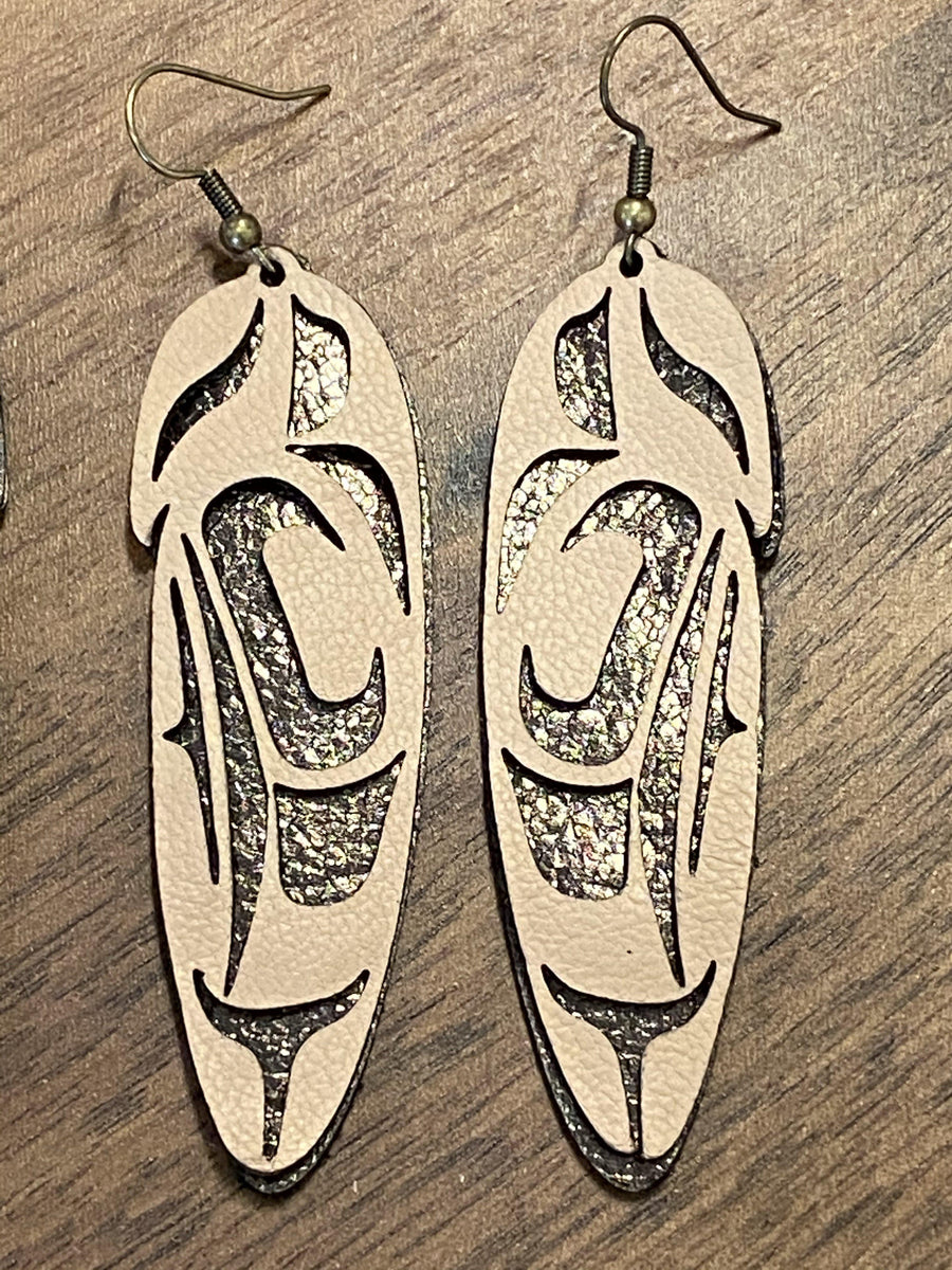 Close up of feather earrings by indigenous artist leather 3