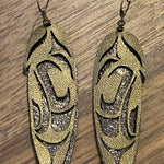 Close up of feather earrings by indigenous artist leather 6
