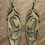 Close up of feather earrings by indigenous artist leather 6