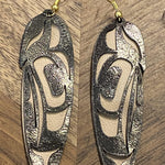 Close up of feather earrings by indigenous artist leather 7
