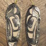 Close up of feather earrings by indigenous artist leather 7