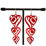 Close up up of heart drops earrings by indigenous artist acrylic 2