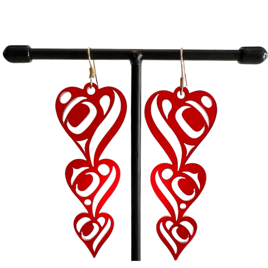 Close up up of heart drops earrings by indigenous artist acrylic 2