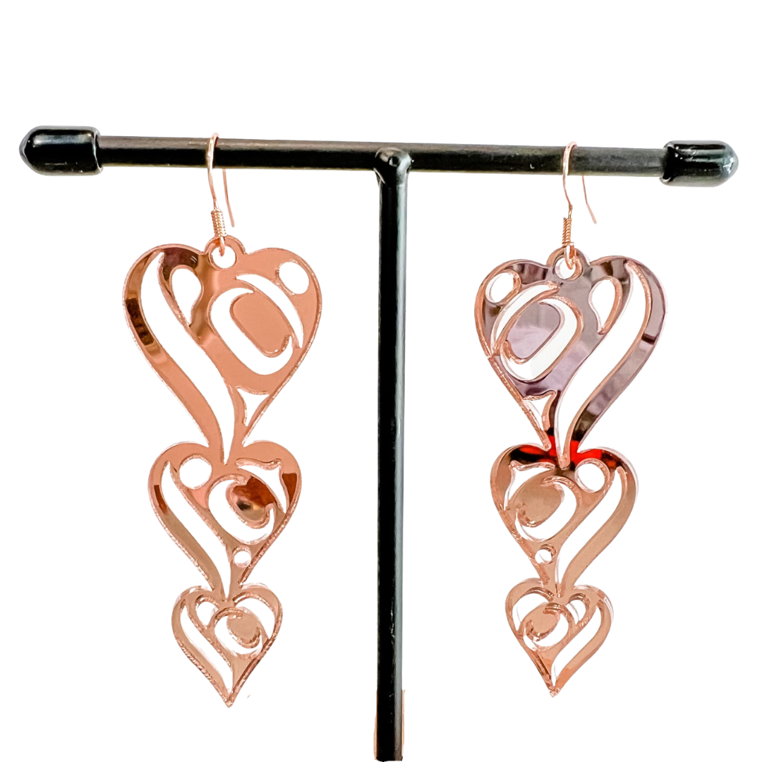 Close up up of heart drops earrings by indigenous artist acrylic 3