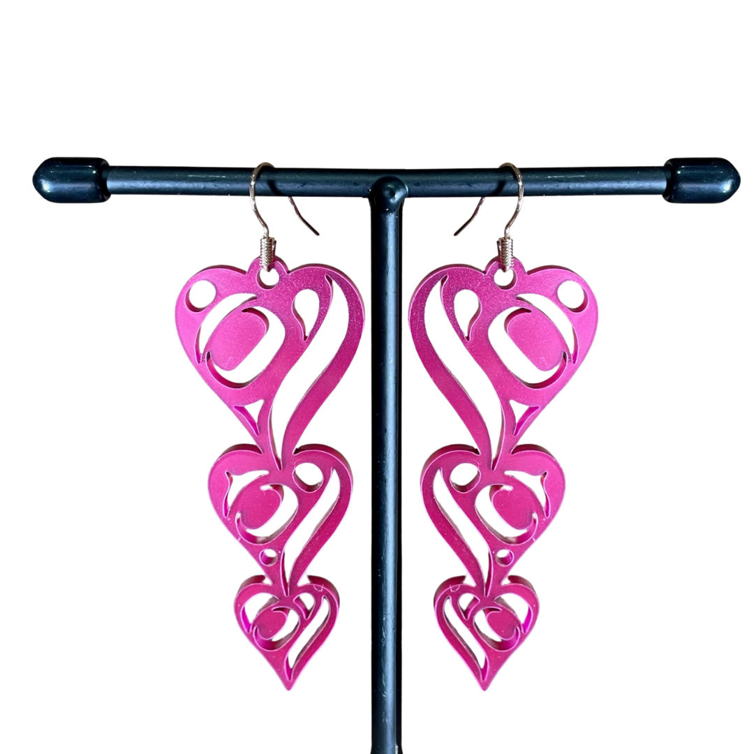 Close up up of heart drops earrings by indigenous artist acrylic 4