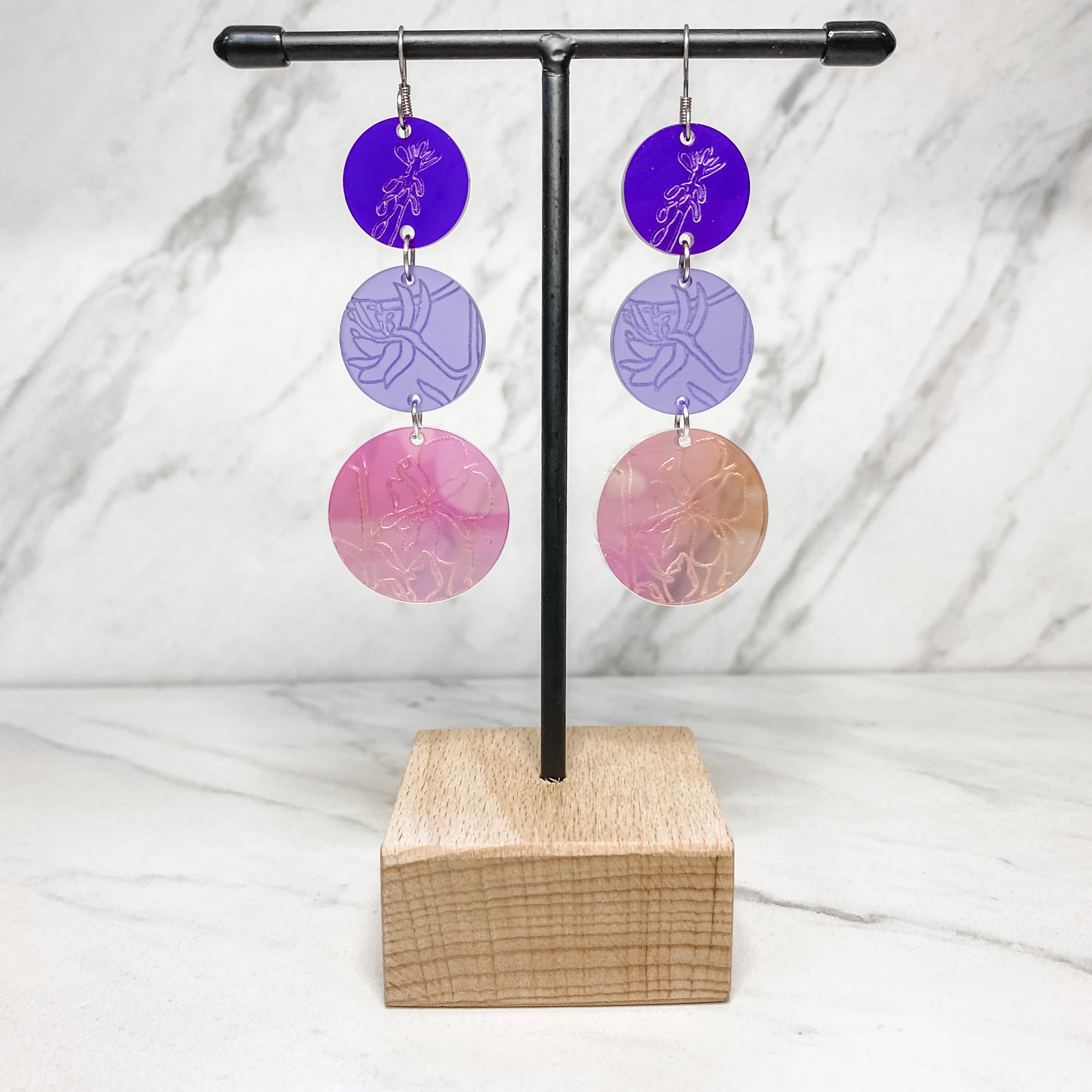Close up of medicine collection earrings by indigenous artist acrylic