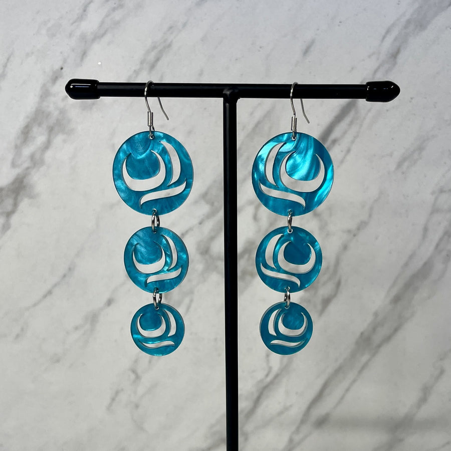 Close up of earrings Moon Drops by indigenous artist acrylic 5